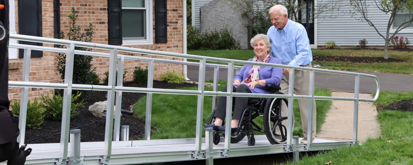 Couple using a residential wheelchair ramp