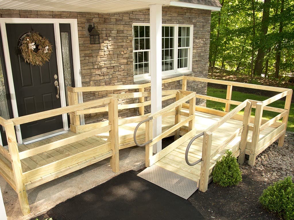 Wood deck wheelchair ramp built into a home entry