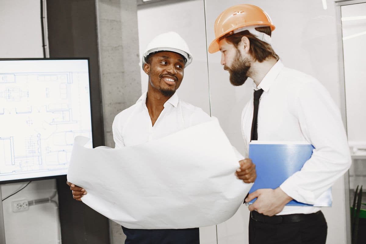 Contractors reviewing renovation plans together